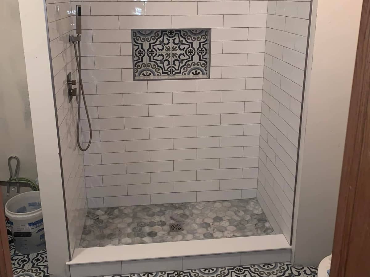 New bathroom shower with white tiles