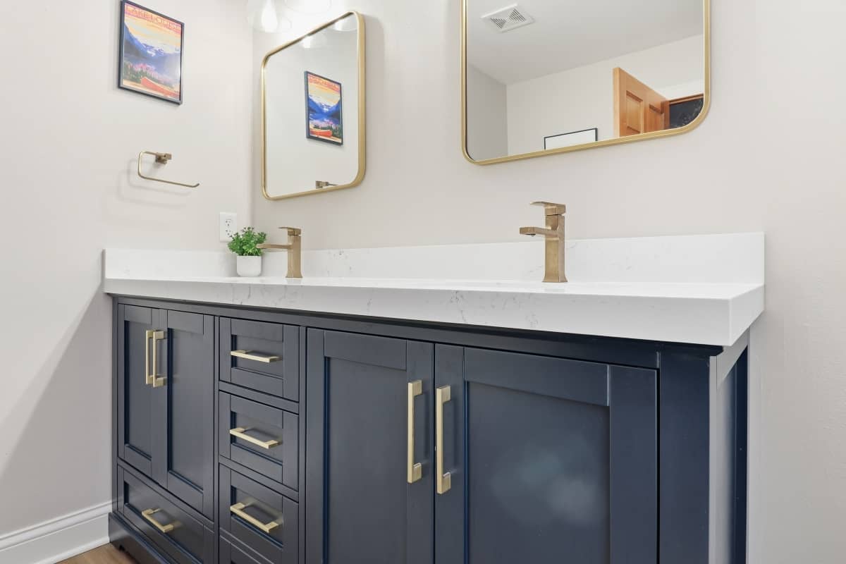 Double vanity with blue cabinets installed in a Hartland bathroom remodel