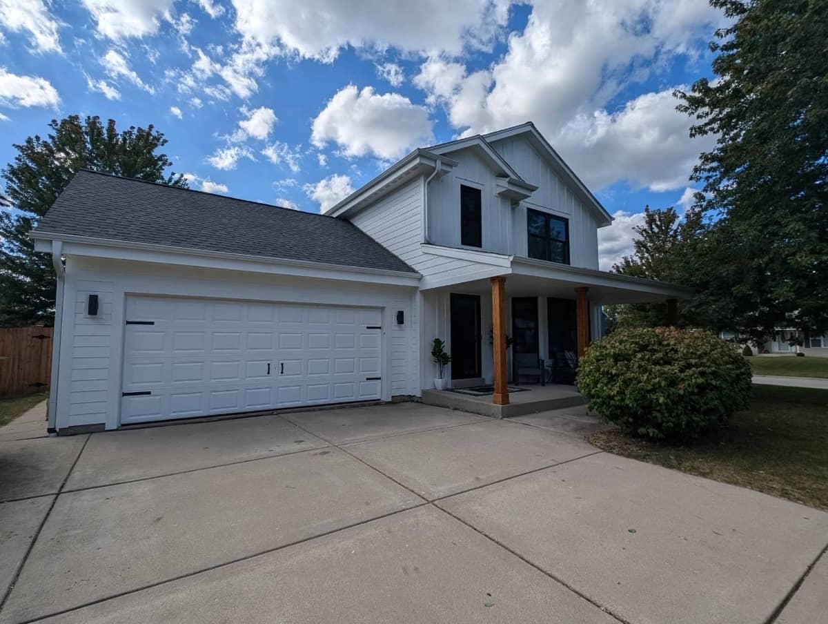 White home siding installation