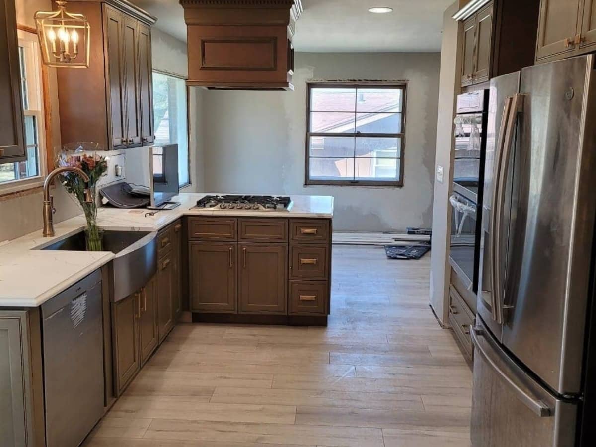 Kitchen remodel with brand new appliances and wooden cabinets