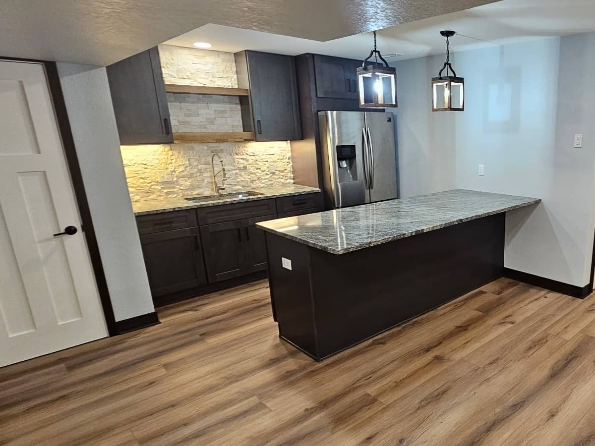 Kitchen Renovation with marble countertops and blue cabinets