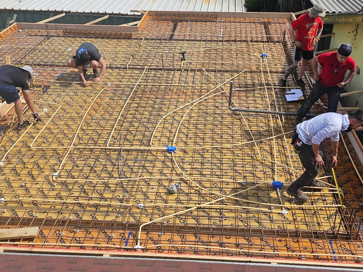 Workers working on a roof renovation and framing